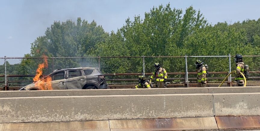 [CREDIT: Rob Borkowski] WFD firefighters from Tower Ladder 1 work to put out a stubborn East Avenue car fire Tuesday, June 18, 2024.