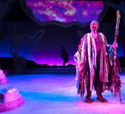[CREDIT: Susanna Jackson] Mauro Hantman as Prospero appearing in colorful costume on one of the dazzling sets of Trinity's 'La Tempestad.'