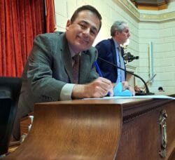 [CREDIT: Vanessa Baker] House Speaker Joe Shekarchi (D- Dist. 23, Warwick) signs the Casino smoking ban bill March 20 at the State House.
