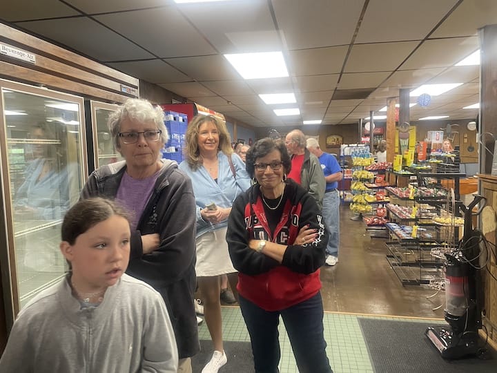[CREDIT: Rob Borkowski] Among the customers at Suzy Q's Summit General Grand Opening, Sue Stenhouse, former Warwick City Council member, third from left.