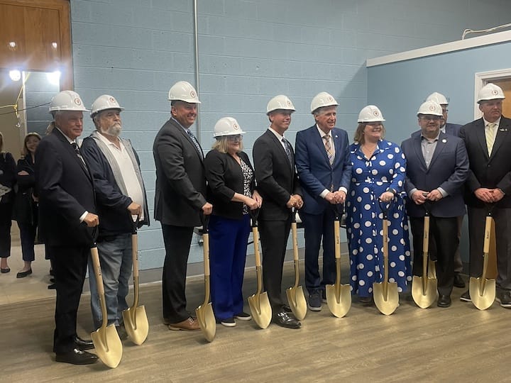 [CREDIT: Rob Borkowski] Gov. Dan McKee, Coventry Town Council members and officials had to pose inside due to rain during the ground breaking ceremony for the Coventry Community Learning Center at the Town Hall Annex Tuesday morning.