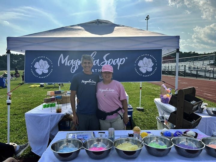 [CREDIT: Natalie Ferland] Yolie and Aaron from Magnolia Soap and Bath Co at their booth, one of the many vendors featured at the Summer Festival.