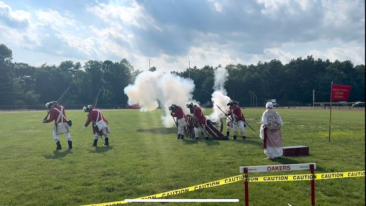 [CREDIT: Natalie Ferland] The Pawtuxet Rangers brace themselves as their cannon fires, signalling the start of the Third Annual Summer Festival.