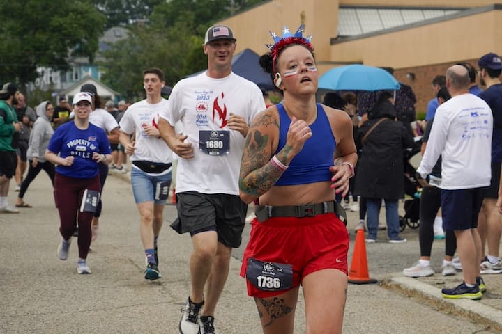[CREDIT: Laura Paton] Susan Bedard of Warwick shows off her red, white and blue in style during the June 14 Gaspee Days 5k.