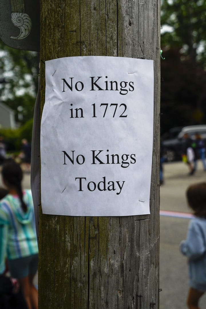 [CREDIT: Laura Paton] A sign posted on utility pole on Broad Street during the 2025 Gaspee Days Parade.
