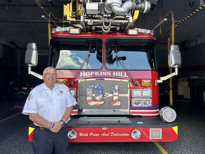 [CREDIT: Natalie Ferland} Hopkins Hill Fire Chief John Potvin, newly hired to take the reins from retired Chief Frank Brown, in front of the Hopkins Hill station.