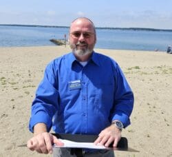 [CREDIT] Rex Wilmouth, State Director of the Environment Rhode Island Research & Policy Center, at Oakland Beach Friday to speak about infrastructure needed to prevent rising RI beach bacteria health risks.