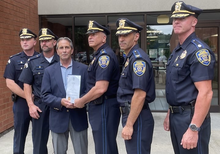 [CREDIT: Rob Borkowski] From left, Major Robert Hart,  Major Joel Thomas, Mayor Frank Picozzi, Maj. Charles Boisseau, Chief Michael Lima and Dep. Chief Andrew Sullivan.The officers were gathered to honor Boisseau for his house fire heroics, helping his Cranston neighbors safely out of a house fire July 5.