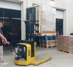 [CREDIT: Lincoln Smith, Photographic Society of RI member] Caden Denton unloading donated food at West Bay Marketplace, 487 Jefferson Blvd., on July 14.