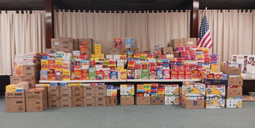[CREDIT: Lincoln Smith/ Photographic Society of RI] The 2025 Cereal Challenge collected 2,165 boxes of cereal for West Bay Marketplace during the food drive.
