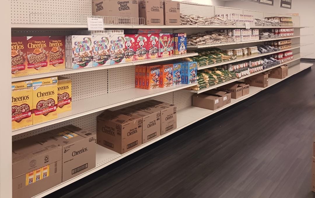 [CREDIT: Lincoln Smith/ Photographic Society of RI] Shelves of cereal stocked at West Bay Marketplace during the Cereal Challenge food drive.