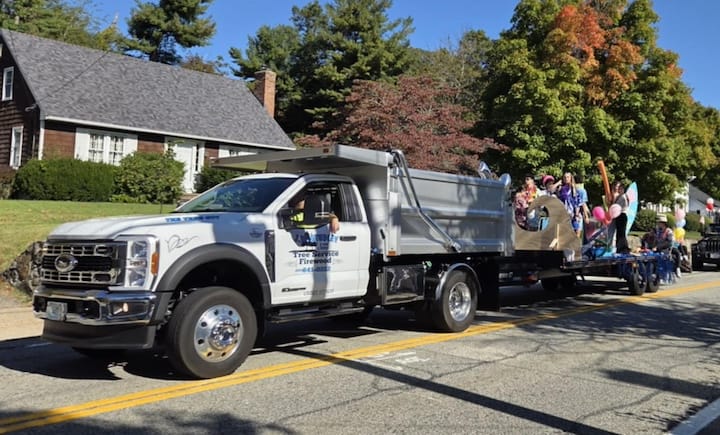 [CREDIT: Mary Carlos] Coventry's Studley Tree Service rides with the CHS Homecoming parade Oct. 4, 2025