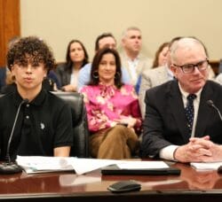 Pilgrim High School student Tre Roberson testifies in favor of legislation introduced by Rep. Joseph McNamara that would mandate the use of soft-shell helmet covers for high school football players.