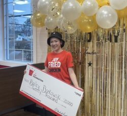 [CREDIT: Rob Borkowski] Bailey Borkowski with a giant $20,000 check for the KFC Foundation Scholarship she won. The check was presented to her at the Coventry KFC store April 1 in a surprise presentation.