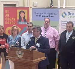 [CREDIT: Rob Borkowski] From Left, Robin Allgood, Living Kidney Donor, Mayor Frank Picozzi, Scott Nerney, Donor Spouse, Speaker K. Joseph Shekarchi (D-District 23), and, in front, Matthew Boger, Senior Director of Government Relations, New England Donor Services (NEDS), at City Hall to celebrate the power of organ donation for National Give Life Day.
